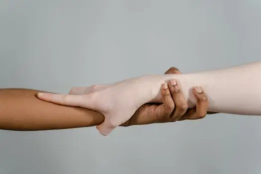 Close-up of hands showcasing diversity and unity through different skin tones.